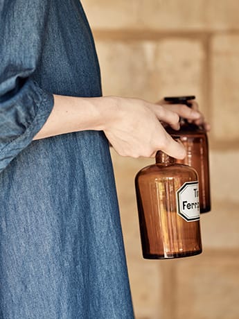 Homeopathy remedy jars in hands